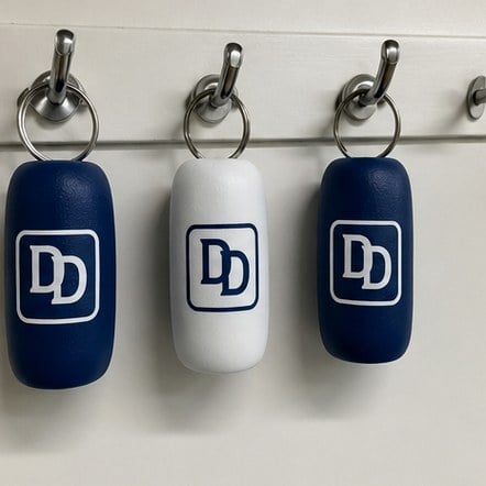 Customized floating keychains for dive and snorkel operators